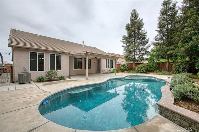 view of pool featuring a patio, central air condition unit, a fenced in pool, and a fenced backyard