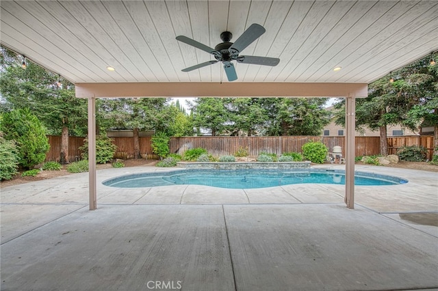 view of pool with a fenced in pool, a patio area, ceiling fan, and a fenced backyard