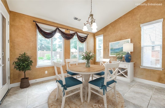 dining room with visible vents, a notable chandelier, vaulted ceiling, and baseboards