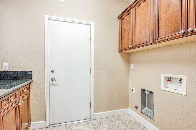 washroom featuring baseboards, hookup for a washing machine, cabinet space, and electric dryer hookup