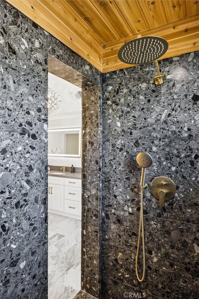 10815 San Marcos Rd, Atascadero, CA 93422 - room details with visible vents, a tile shower, wood ceiling, and vanity