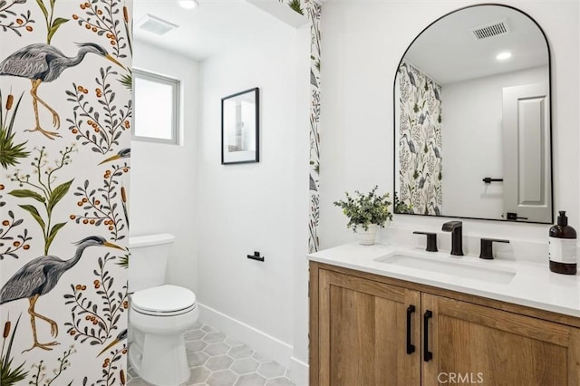 10815 San Marcos Rd, Atascadero, CA 93422 - bathroom featuring visible vents, baseboards, toilet, and vanity