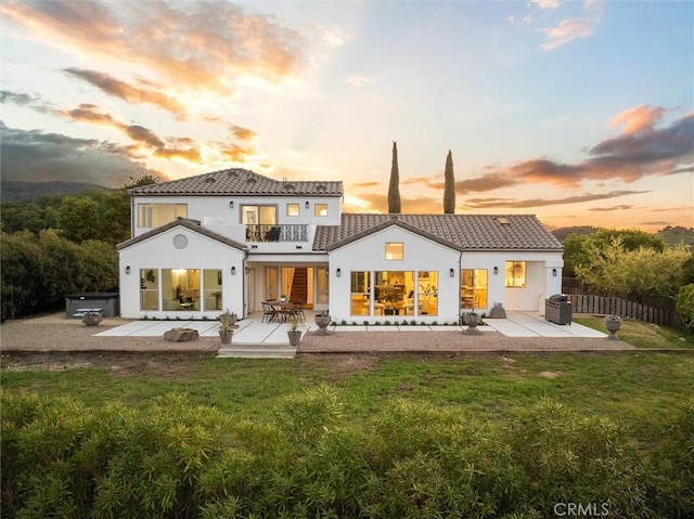 10815 San Marcos Rd, Atascadero, CA 93422 - back of house featuring fence, a balcony, a patio area, a lawn, and a tile roof