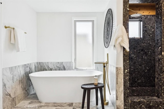 10815 San Marcos Rd, Atascadero, CA 93422 - full bath with marble finish floor, tile walls, tiled shower, a wainscoted wall, and a soaking tub