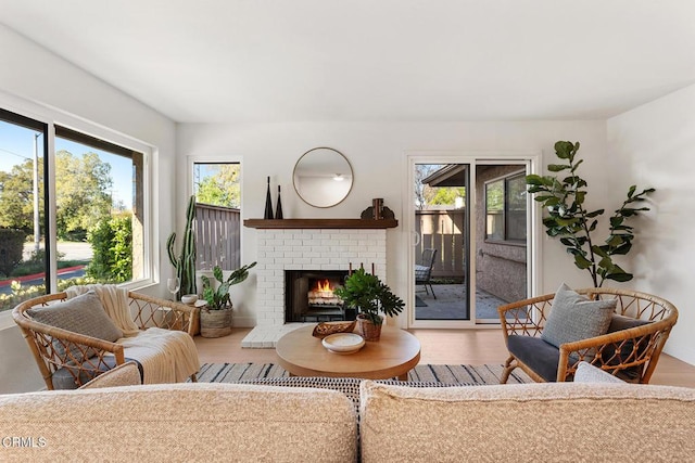 4490 Lubbock Dr Unit D, Simi Valley, CA 93063 - living area featuring a brick fireplace and wood finished floors