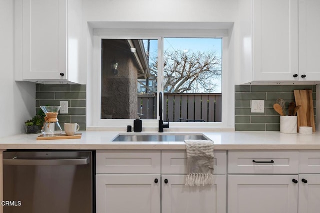 4490 Lubbock Dr Unit D, Simi Valley, CA 93063 - kitchen with white cabinetry, tasteful backsplash, a sink, and dishwasher