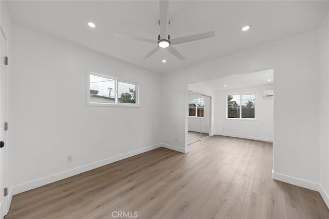 unfurnished room with baseboards, recessed lighting, a ceiling fan, and light wood-style flooring