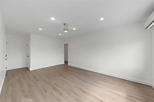 empty room with light wood-style floors, ceiling fan, recessed lighting, and baseboards