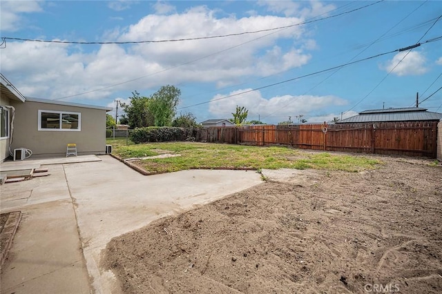 view of yard featuring a patio and a fenced backyard