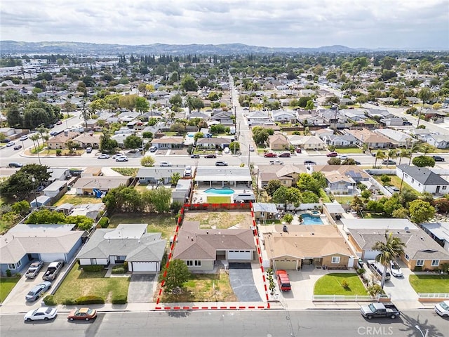 drone / aerial view featuring a mountain view and a residential view