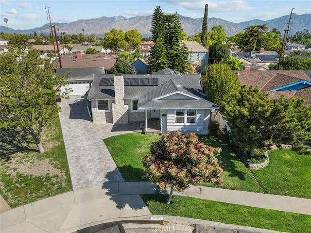 drone / aerial view featuring a mountain view and a residential view