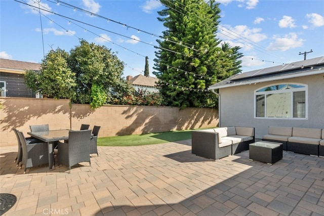 view of patio / terrace with fence, outdoor dining space, and outdoor lounge area