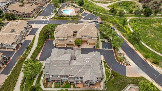 birds eye view of property with a residential view