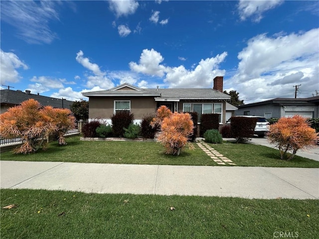 325 E 59th, Long Beach, CA 90805 - ranch-style house featuring a front lawn, a chimney, and stucco siding
