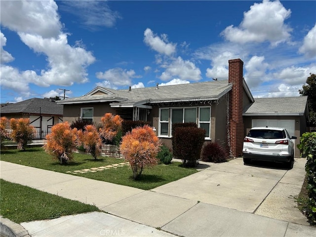325 E 59th, Long Beach, CA 90805 - single story home featuring an attached garage, stucco siding, concrete driveway, a chimney, and a front yard