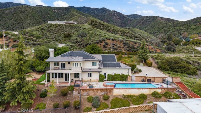280 W 26th St, Upland, CA 91784 - exterior space featuring a chimney, a fenced backyard, a balcony, a patio, and stucco siding