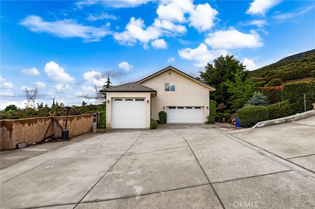 280 W 26th St, Upland, CA 91784 - garage featuring concrete driveway and a mountain view