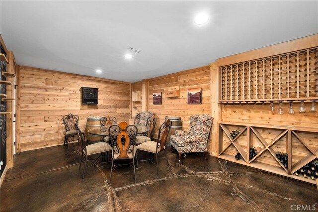 280 W 26th St, Upland, CA 91784 - wine room with finished concrete flooring, wood walls, and recessed lighting