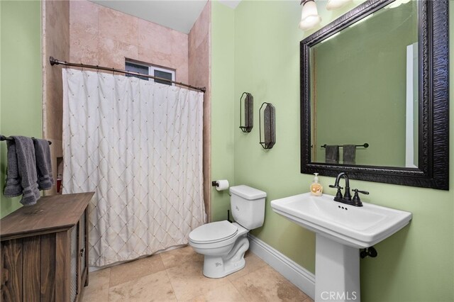 280 W 26th St, Upland, CA 91784 - full bath with toilet, a shower with shower curtain, baseboards, a sink, and tile patterned floors