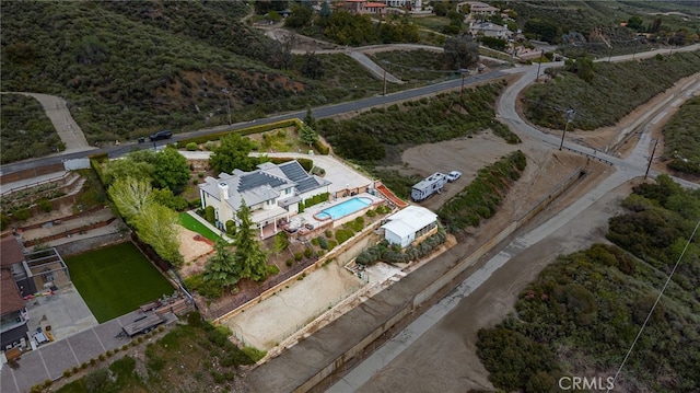 aerial view of property's location featuring a pool