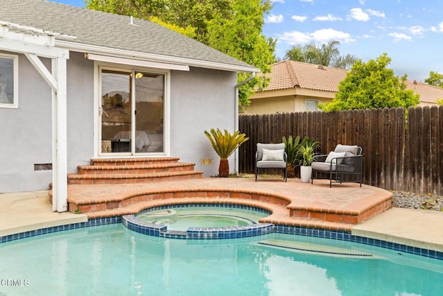 view of swimming pool with fence, a fenced in pool, a patio, entry steps, and an in ground hot tub