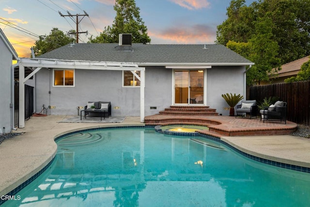 back of house featuring a patio, fence, entry steps, and stucco siding
