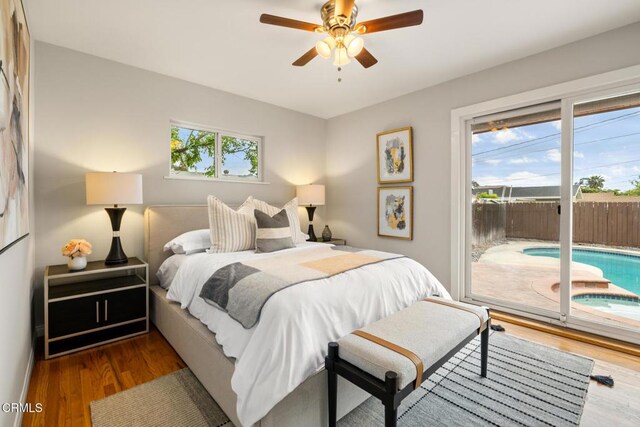 bedroom featuring wood finished floors, a ceiling fan, and access to exterior