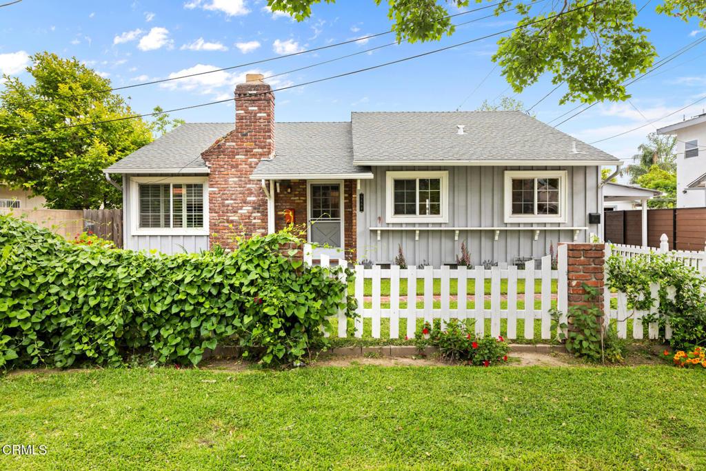9664 Workman Ave, Temple City, CA 91780 - view of front of property with roof with shingles, board and batten siding, a front yard, and fence private yard