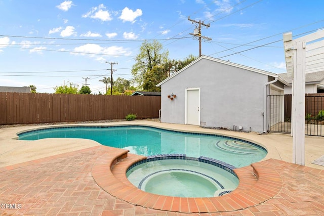 view of swimming pool featuring a fenced backyard, a patio area, and a pool with connected hot tub