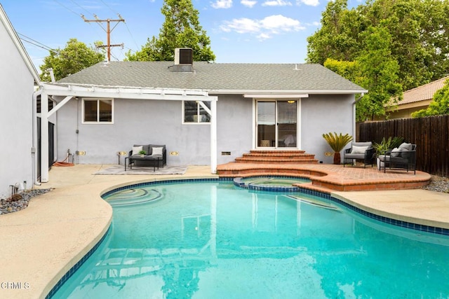 view of swimming pool with a patio, entry steps, a pool with connected hot tub, and fence