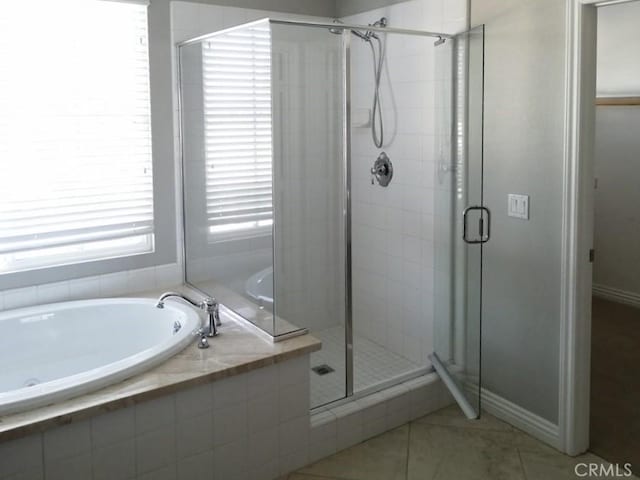 1027 Palmetto Way, Costa Mesa, CA 92626 - bathroom featuring tile patterned floors, baseboards, a stall shower, and a garden tub