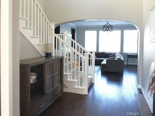 1027 Palmetto Way, Costa Mesa, CA 92626 - stairway with baseboards, ornamental molding, arched walkways, and hardwood / wood-style flooring