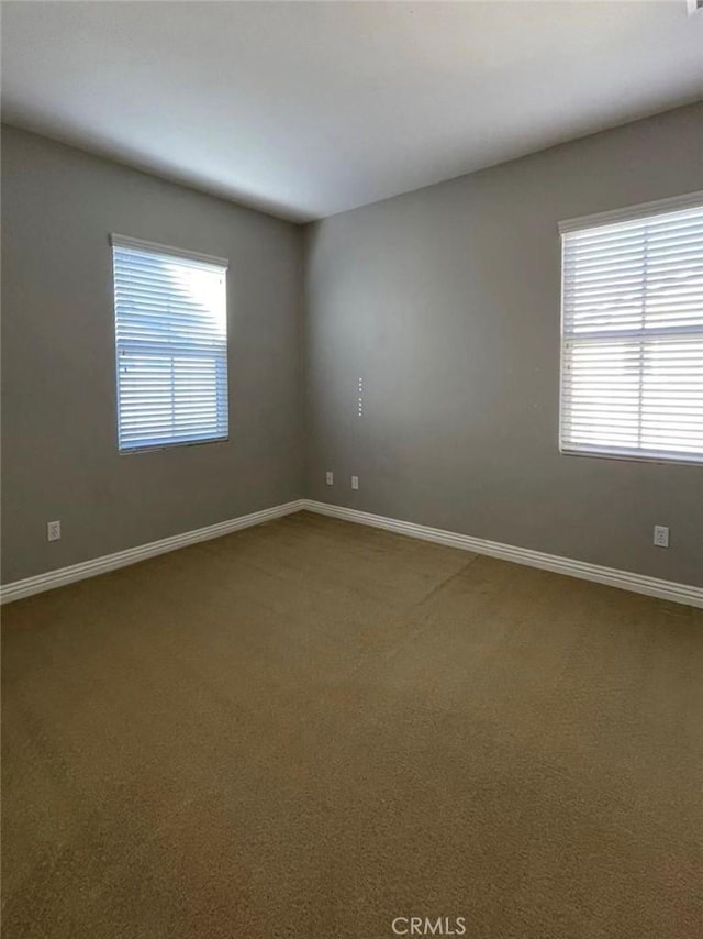1027 Palmetto Way, Costa Mesa, CA 92626 - carpeted spare room featuring baseboards and plenty of natural light