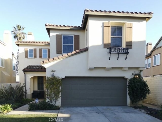 1027 Palmetto Way, Costa Mesa, CA 92626 - mediterranean / spanish home featuring an attached garage, driveway, a tile roof, and stucco siding