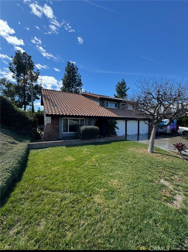 view of front facade featuring a garage, a front lawn, concrete driveway, and a tile roof