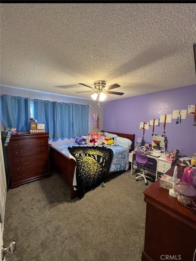 carpeted bedroom featuring a textured ceiling and ceiling fan