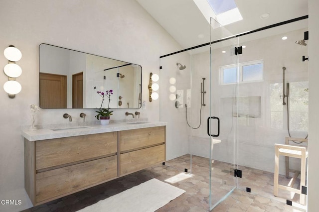 1820 Ramona Dr, Camarillo, CA 93010 - full bath with double vanity, a sink, a stall shower, and vaulted ceiling with skylight