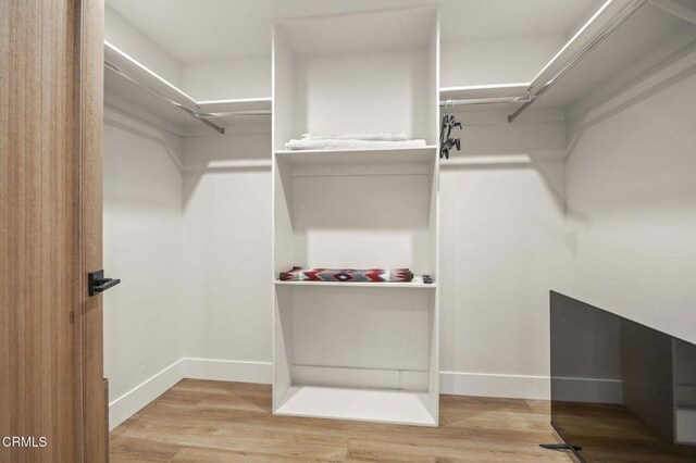 1820 Ramona Dr, Camarillo, CA 93010 - walk in closet with wood finished floors