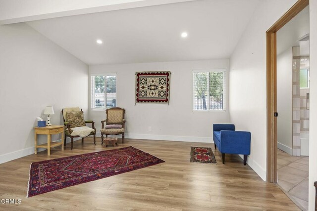1820 Ramona Dr, Camarillo, CA 93010 - living area featuring baseboards, wood finished floors, and vaulted ceiling