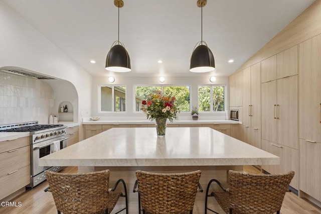 1820 Ramona Dr, Camarillo, CA 93010 - kitchen featuring light countertops, appliances with stainless steel finishes, modern cabinets, and lofted ceiling