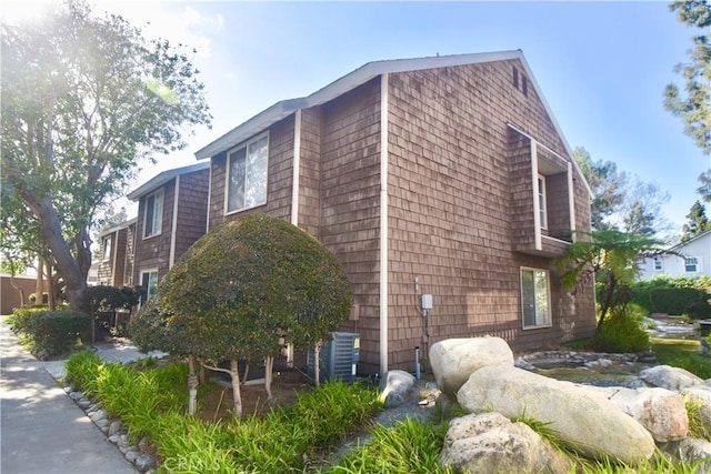 view of side of property featuring central AC unit