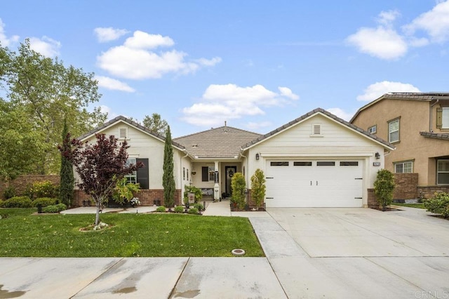 single story home with an attached garage, a front lawn, brick siding, concrete driveway, and a tiled roof