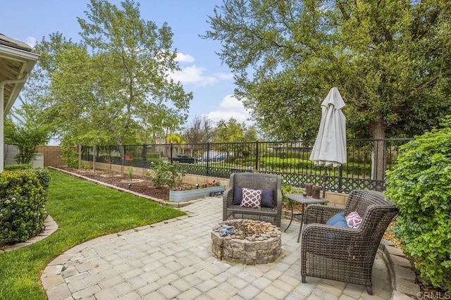 view of patio / terrace featuring a fire pit and a fenced backyard