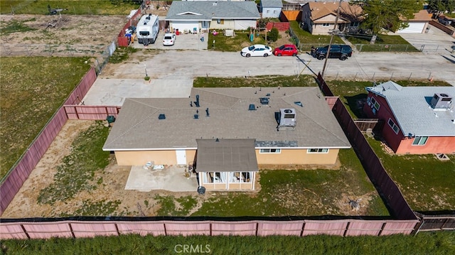 birds eye view of property with a residential view