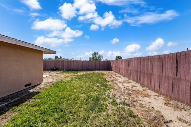 view of yard with a fenced backyard