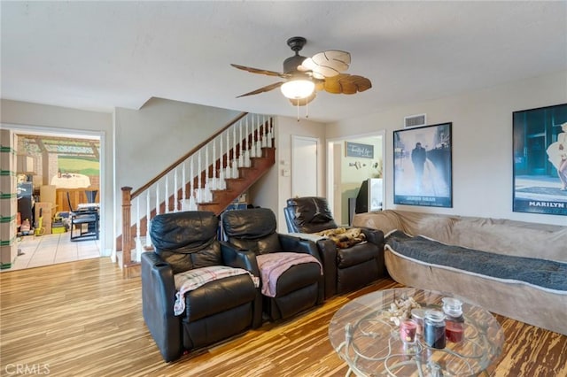24851 Stem Ave, Lake Forest, CA 92630 - living room with stairs, light wood-type flooring, and ceiling fan