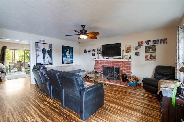 24851 Stem Ave, Lake Forest, CA 92630 - living area featuring a brick fireplace, wood finished floors, and ceiling fan