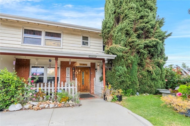 24851 Stem Ave, Lake Forest, CA 92630 - view of front facade with brick siding and a porch