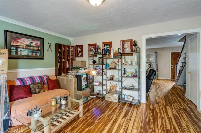 24851 Stem Ave, Lake Forest, CA 92630 - living area with wood finished floors, stairs, a textured ceiling, and crown molding