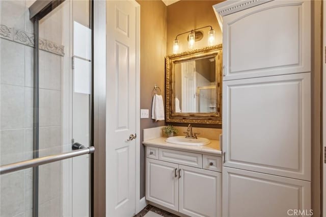 bathroom featuring an enclosed shower and vanity